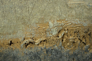 Close-up of an abstract textured painting surface with grey, white, and gold colors highlighting organic movement.
