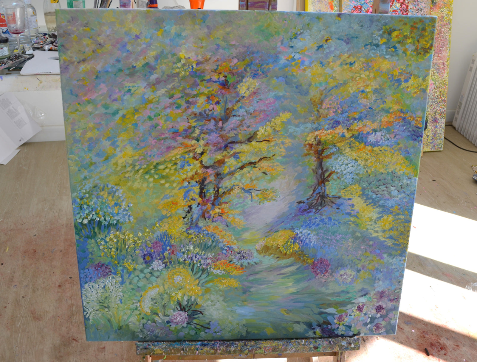 Bluebell Woodland Landscape Painting – a vibrant pathway through colorful foliage and blooming flowers.