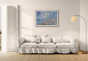 Sidmouth Bay Coastal Painting displayed above a comfortable couch in a modern living room setting.