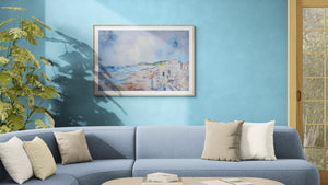 Sidmouth Bay Coastal Painting displayed in a modern living room with blue walls and a comfortable couch.